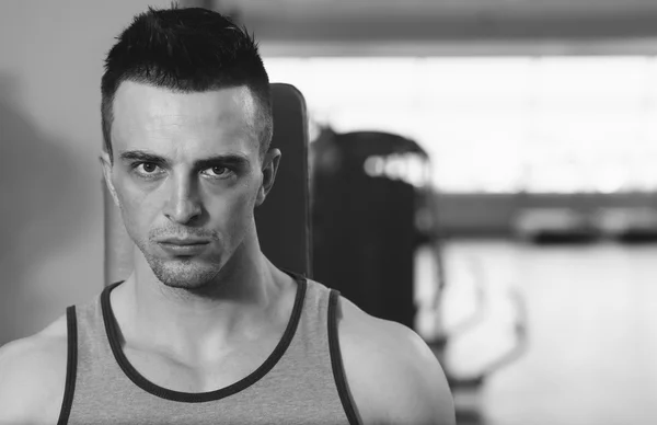 Portrait Of A Physically Fit Young Man In Modern Fitness Center