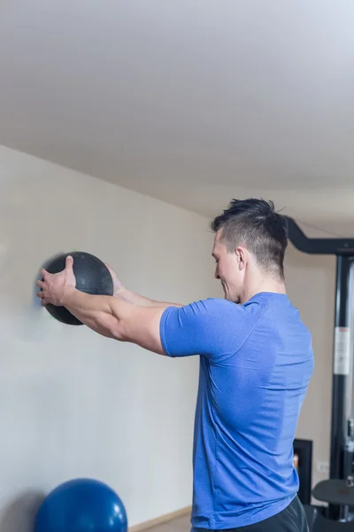 Young Athlete Exercise In The Gym - He Is Performing Triceps Exe