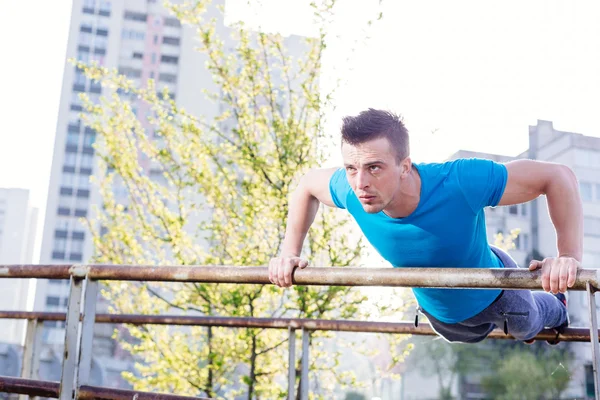 Street workout, confident sportsman