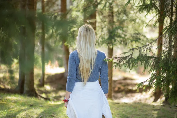 Harmony with nature, back woman in the forest