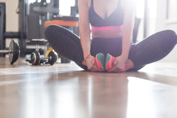 Portrait of a fit and muscular woman doing intense core workout