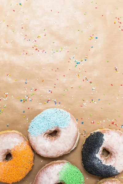 Colorful donuts on  kraft paper