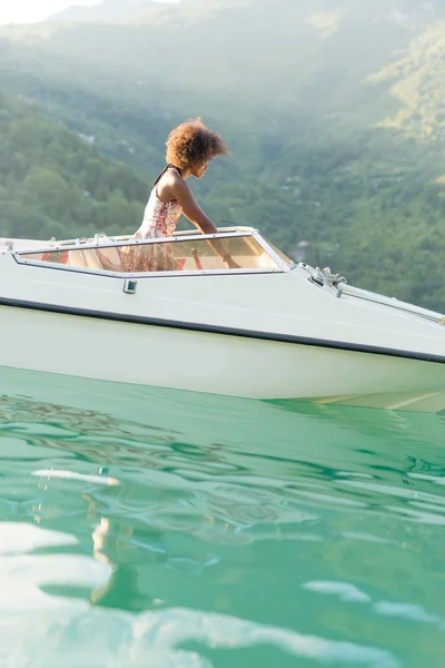 Afro american woman on private yacht