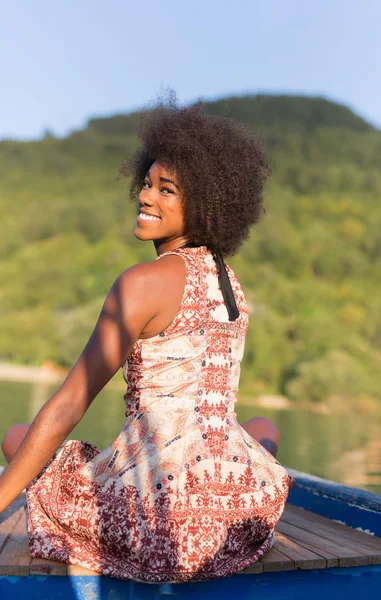 Woman on old fishing boat posing