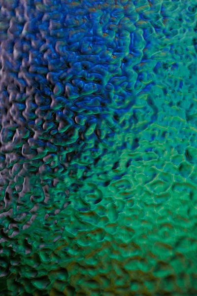 Glass texture back illuminated, macro of abstract glass texture