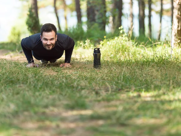 Push ups sport fitness man doing push-ups. Male athlete exercisi