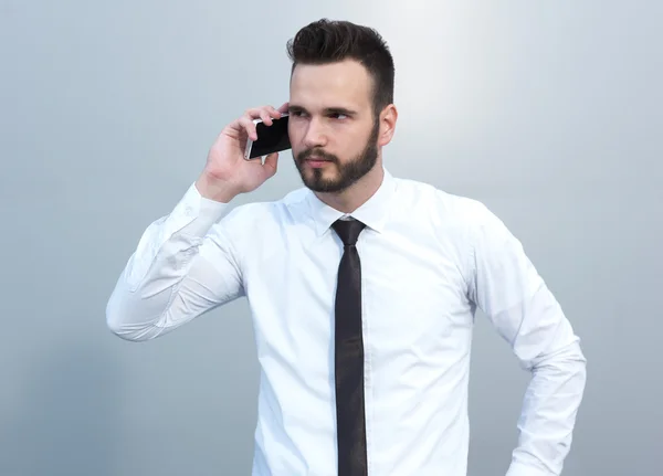 Angry businessman with cell phone