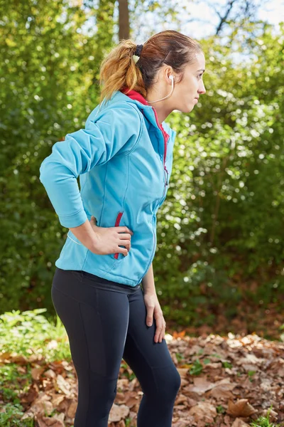 Female runner knee injury and pain.