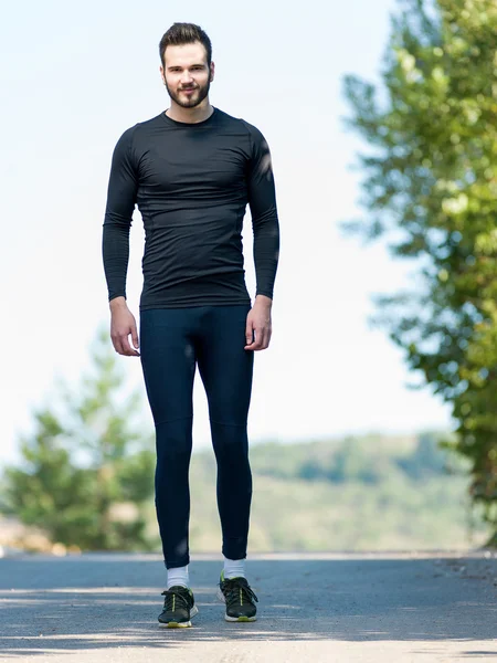 Portrait Of Male Runner in nature after jogging