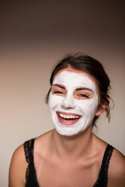 Relaxed woman with a deep cleansing nourishing face mask applied