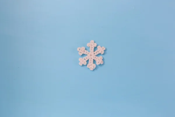 Snowflake big close up. Bokeh a background. Toning is blue