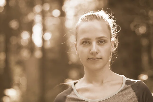 Portrait of a happy young hiker woman in nature. Young caucasian