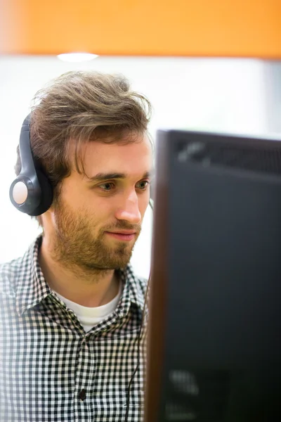 Friendly telephone operator smiling during a telephone conversat