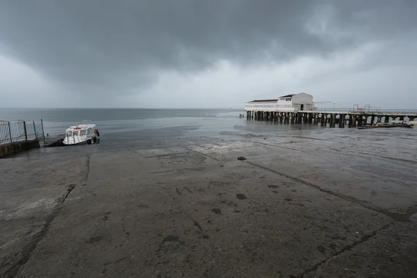 Storm at the pier on the sea, thundercloud