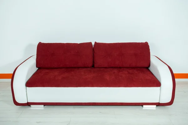 Red-white sofa on a white background