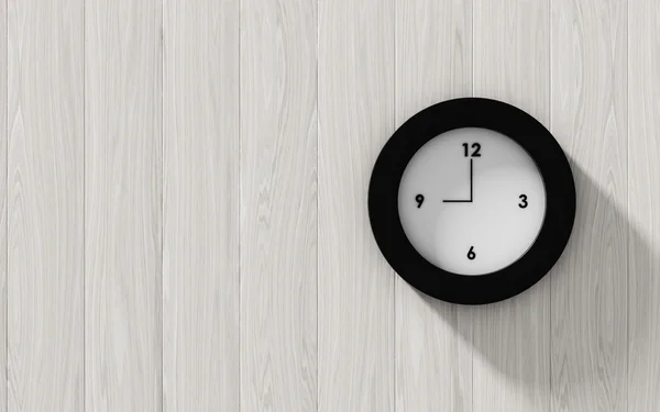 Black clock hanging on the wood wall