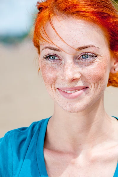 Redhead freckled girl smiling