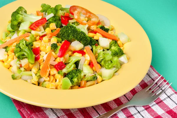 Raw vegetable mix on the yellow plate