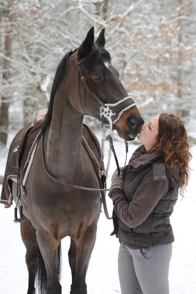 Young woman riding in the snow