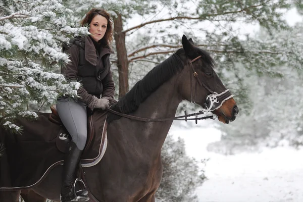 Young woman riding in the snow