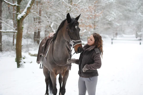 Young woman riding in the snow