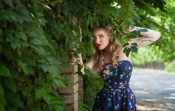 Girl blonde in style Pin-up outdoors