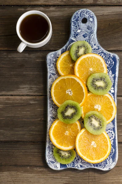 Breakfast crackers with chocolate paste and bananas, coffee and fruit