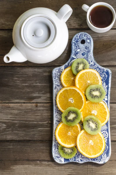 Breakfast crackers with chocolate paste and bananas, coffee and fruit