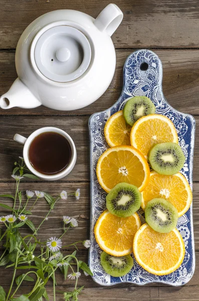 Breakfast crackers with chocolate paste and bananas, coffee and fruit