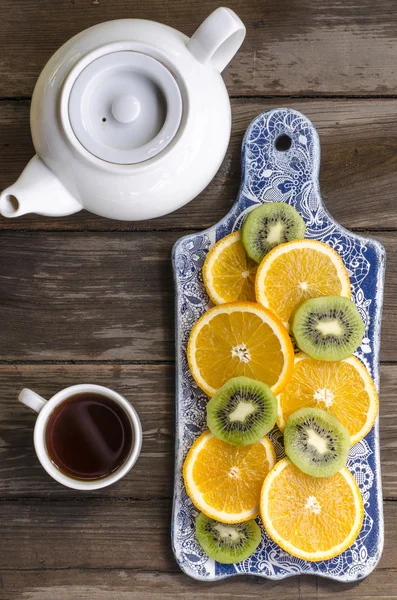 Breakfast crackers with chocolate paste and bananas, coffee and fruit