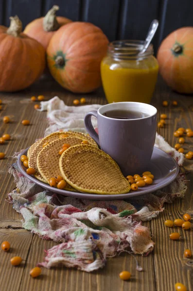 Pumpkin pancakes with sea buckthorn sauce for breakfast