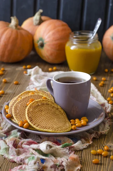 Pumpkin pancakes with sea buckthorn sauce for breakfast