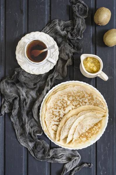 Pancakes for breakfast with kiwi and melon jam