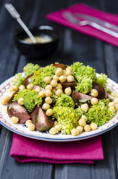 Salad with chickpeas tomatoes and broccoli