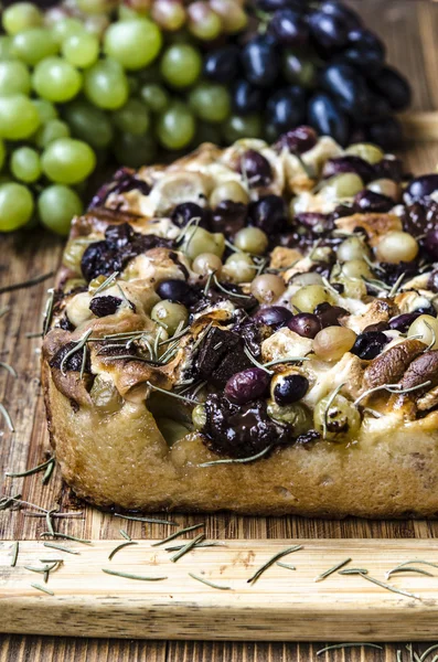 Cake with chocolate and marshmallow grapes