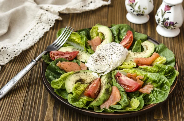 Avocado Salad with Romano tomato salmon and poached egg seasoned