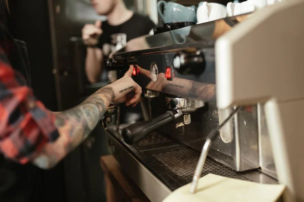 Barista with coffee machine