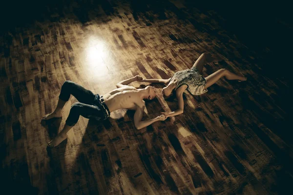 Couple dancing contemporary on floor, top view