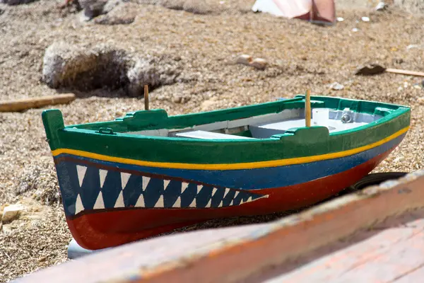 Fishing boat with shark's teeth in Port of Trapani (Sicily, Italy)