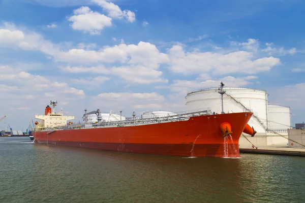Oil tanker moored near oil silo in Port of Antwerp, Belgium