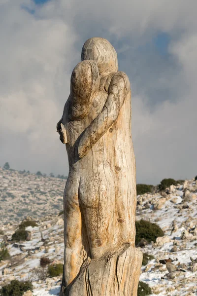 Athens, Greece 02 January 2016. The hope couple wood carving at the park of lost souls (Parko Psychon) at Parnitha mountain.