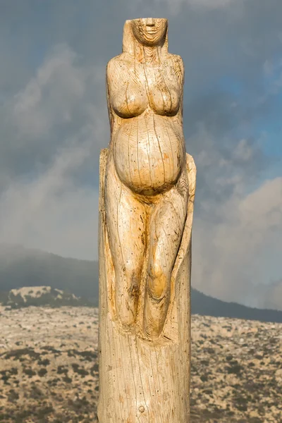 Athens, Greece 02 January 2016. Pregnant woman wood carving at the park of lost souls (Parko Psychon) at Parnitha mountain.