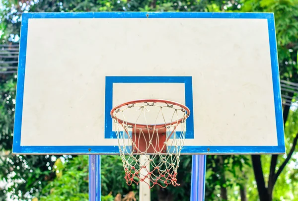 Basketball hoop in the park,  focus basketball hoop