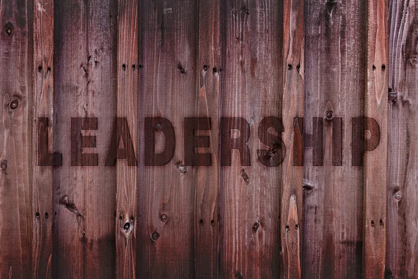 Leadership Concept Background / Leadership Word Engraved on Wood