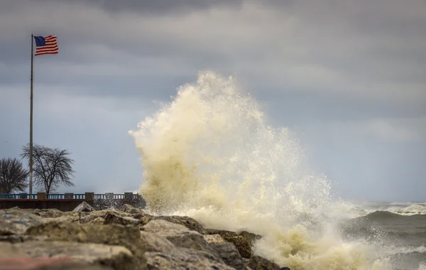 Large Waves crashing against rocky shoreline