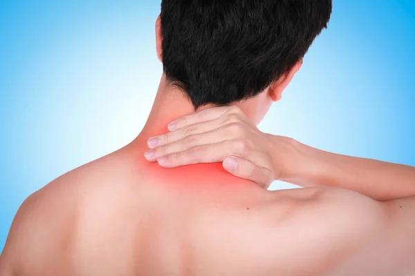 Close up suffering male pain in neck on blue background.