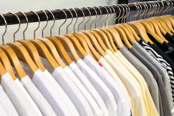 Close up white shirt hanging in wardrobe.