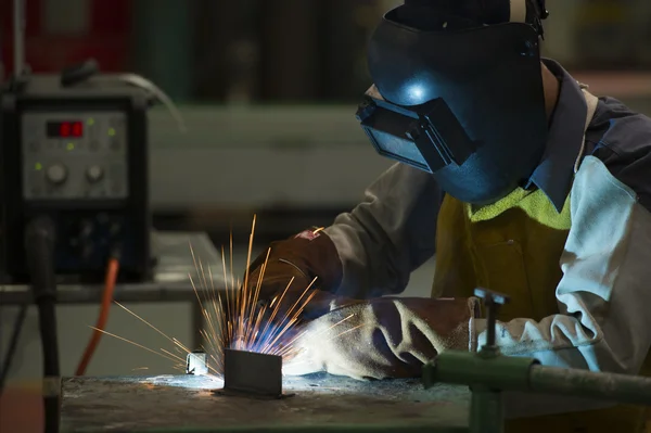 Man welding steel by skill.