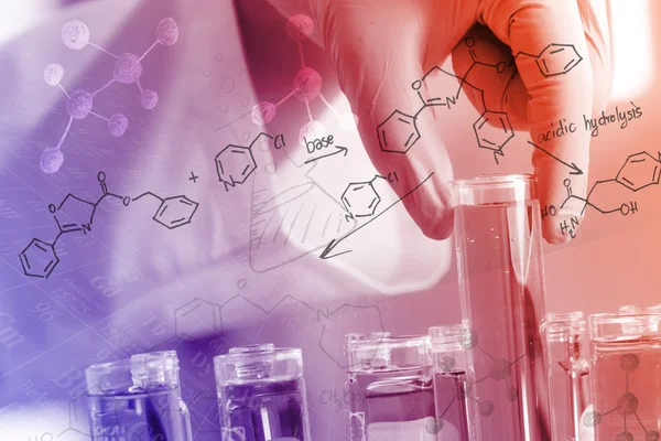 Chemist \'s gloved hand holding the test tube at laboratory, with chemical equations and periodic table background.