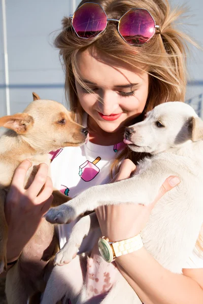 Young woman with puppies